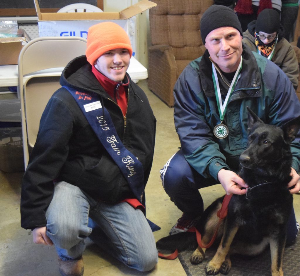 Rick Haney and his dog Aggie pose with Brown County Fair King Tristan Cahall after the Run Into 4-H 5K, held in Georgetown last month.