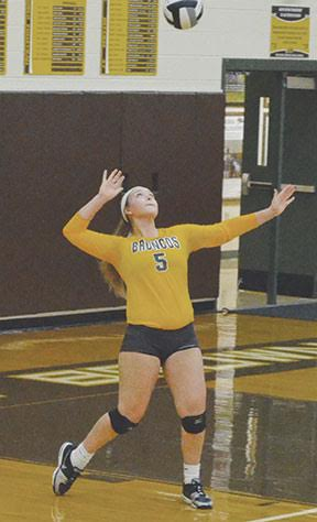 Western Brown’s Mary Sizer delivers a serve in the Lady Broncos’ league win over Batavia.