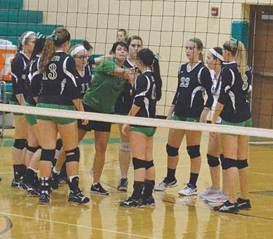 Fayetteville-Perry volleyball coach Sharon Sheets instructs her Lady Rockets during a match this season.