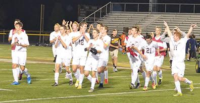 The Western Brown Broncos celebrate their sectional tournament win over Monroe during their last home game of the season at Kibler Stadium/LaRosa’s Field on Oct. 20.