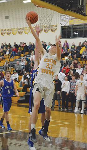 Western Brown’s Elijah Smith scores on a reverse during the Broncos’ Dec. 13 league contest against Amelia.