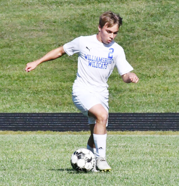 <p>Williamsburg’s Ethan Shouse prepares to pass the ball to a teammate. Photo by Garth Shanklin.</p>
