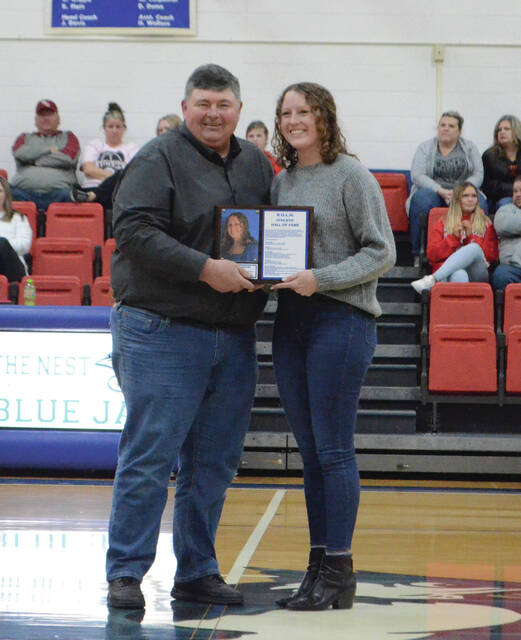 <p>Kelsey Carpenter with basketball coach Chris Coleman. Photo by Wade Linville</p>