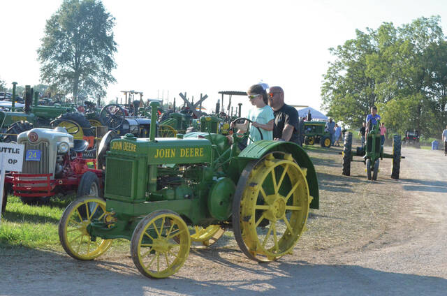 129883526_web1_OVAMS-5 Some kids got the chance to climb into the drivers seat of some of the antique machinery during this years Ohio Valley Antique Machinery Show in Brown County. Photo by Wade Linville