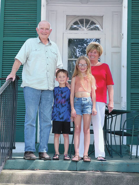 129934320_web1_DavidGray
From left, David Gray, grandson Lincoln, granddaughter Saylor, and wife Linda in front of their Ripley home. (Photo by Sherry Larson)