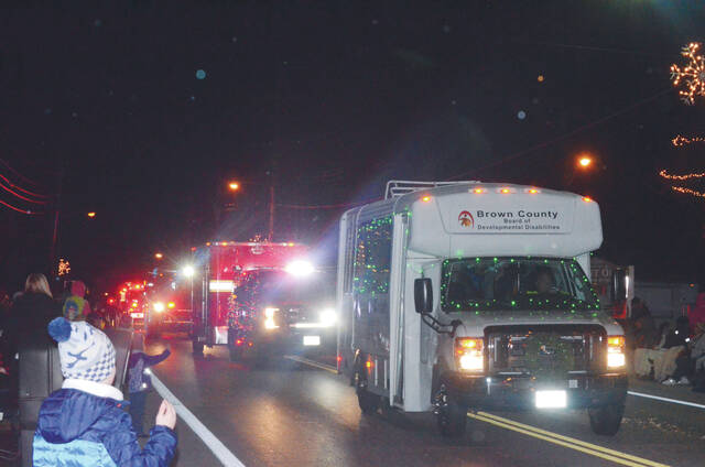 130178378_web1_DSC_0102
Children waved as the Mt. Orab Christmas Parade passed by on the evening of Nov. 25. Photo by Wade Linville