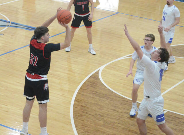 Easterns Braxton Vance fires off a shot from three-point range during the Warriors Feb. 19 win at Ripley. Photo by Wade Linville